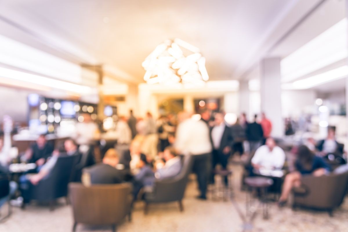 Vintage tone blurred motion people have happy hour, casual business meeting at the lobby of luxury hotel in San Francisco, California, USA. Blurry abstract background industry networking event