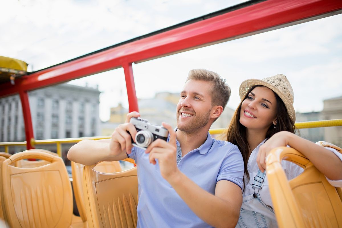 Smiling couple at the tour bus